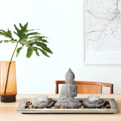 Buddha mit Teelichthalter und Dekosteinen