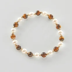 Muschelarmband mit Tigerauge