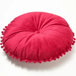 Rundes Kissen mit Knopf in der Mitte, rot