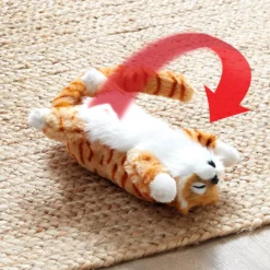 Spielzeugkatze "Ginger" rollend & lachend